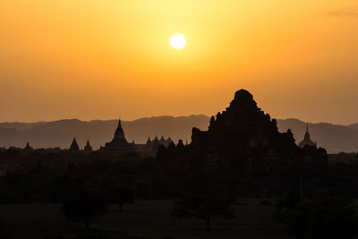 Temple against sky during sunset