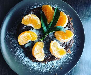 High angle view of fruits in plate on table