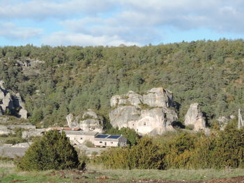 Built structure on landscape against sky