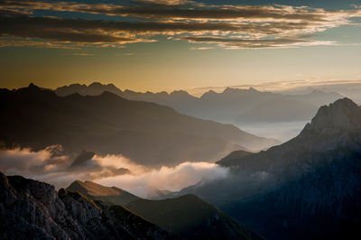 Scenic view of mountains against sky during sunset