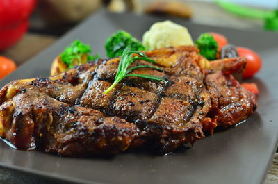 Close-up of meat on barbecue grill