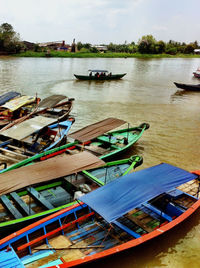 Boats moored in sea