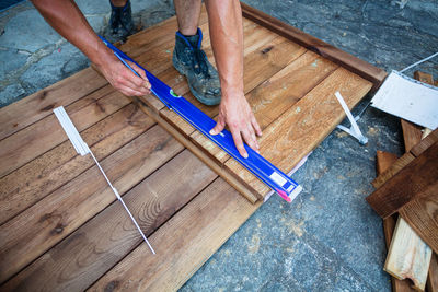 Low section of carpenter making furniture