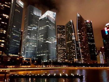 Low angle view of illuminated buildings against sky