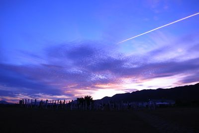 Scenic view of landscape against sky at sunset