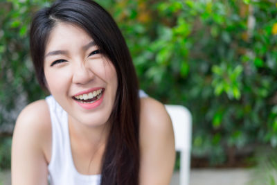 Young woman sitting at outdoor cafe