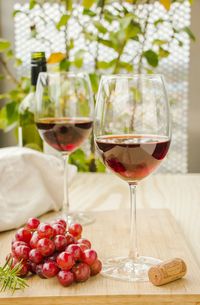 Grapes with red wine served on table