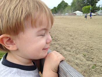 Close-up of cute boy looking away