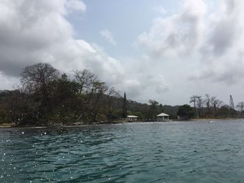 Scenic view of sea against cloudy sky