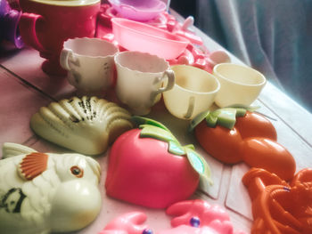 Close-up of multi colored coffee cup on table