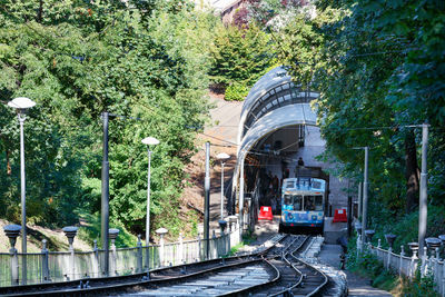 Train on railroad track in city