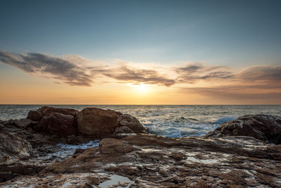 Scenic view of sea against sky during sunset