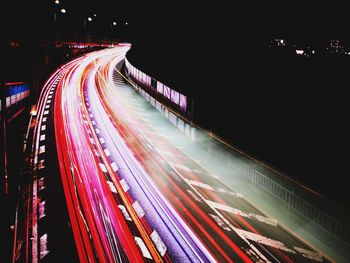 High angle view of light trails on road