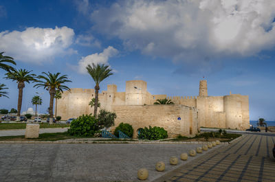 View of historical building against cloudy sky