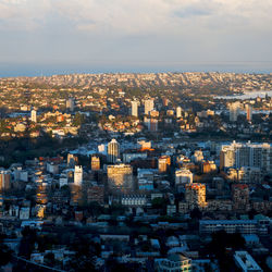 High angle view of city buildings against sky