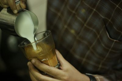 Close-up of hand holding drink