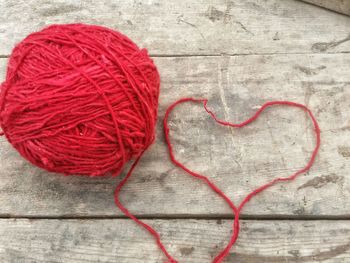 Directly above shot of red heart shape on table