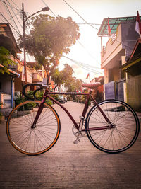 Bicycles on street against buildings in city