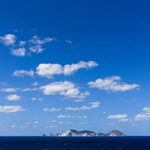 Scenic view of sea against blue sky