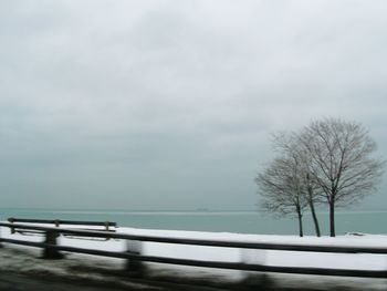Scenic view of sea against storm clouds