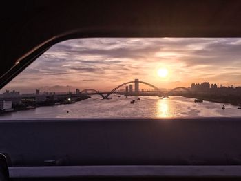 View of suspension bridge at sunset