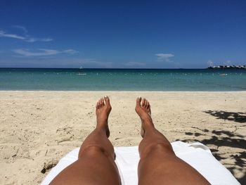 Low section of woman on beach