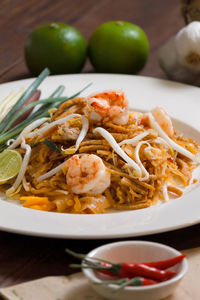 High angle view of pad thai in plate on table
