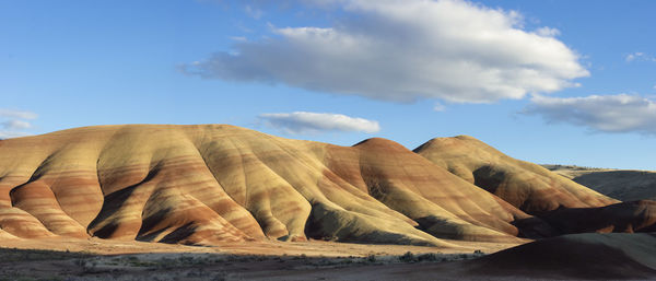 Rock formations in desert against sky