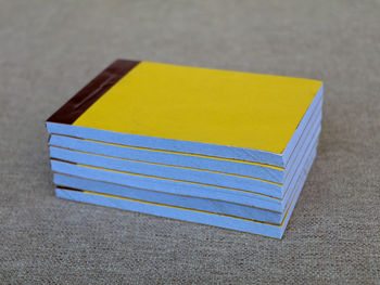 High angle view of yellow paper on table