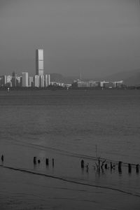 Scenic view of sea and buildings against sky