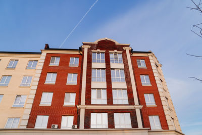 Low angle view of building against blue sky