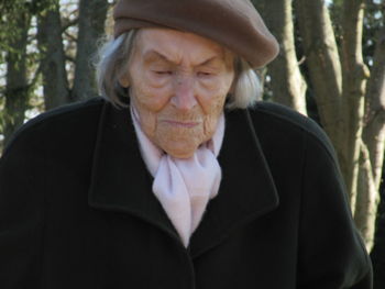 Portrait of man wearing hat in forest