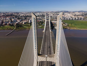 High angle view of suspension bridge in city
