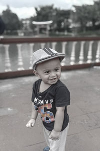 Portrait of cute boy standing outdoors