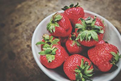 High angle view of strawberries in bowl on table