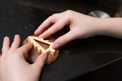 High angle view of person hand holding ice cream