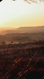 Scenic view of landscape against sky during sunset