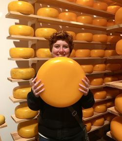 Portrait of smiling woman standing in tray
