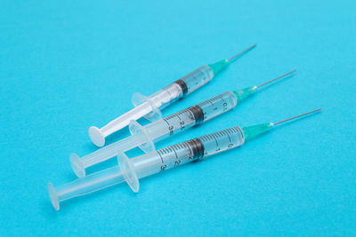 High angle view of keys on blue background