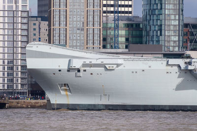 Boats moored on buildings in city