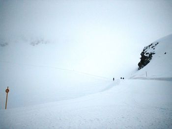View of people skiing in snow