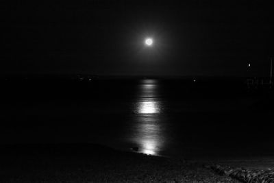 Scenic view of sea against sky at night