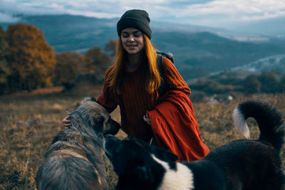 Young woman with horse in winter