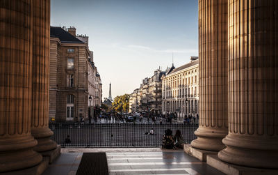 Street amidst buildings in city against sky