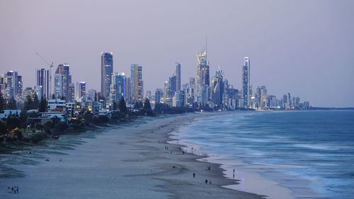 Panoramic view of sea and buildings against clear sky