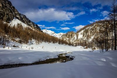 Scenic view of snowcapped mountains against sky