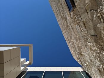 Low angle view of building against clear blue sky