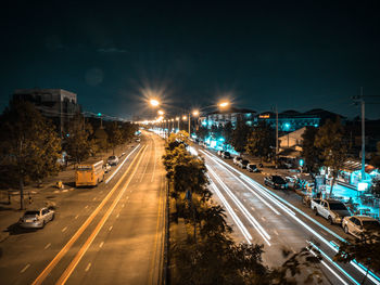 High angle view of light trails on road at night