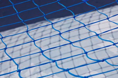 Blue net over white background