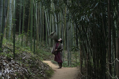 View of a woman in the bamboo forest